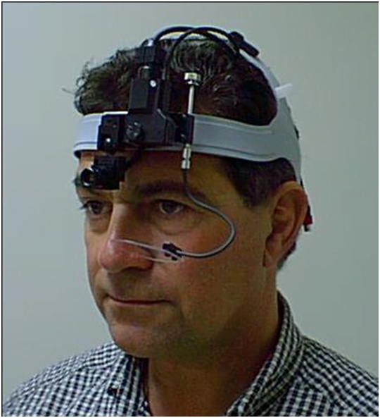 man wearing retina tracking device